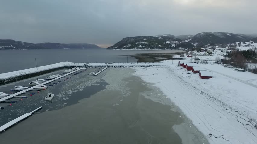 Aerial of Norwegian winter frozen harbor