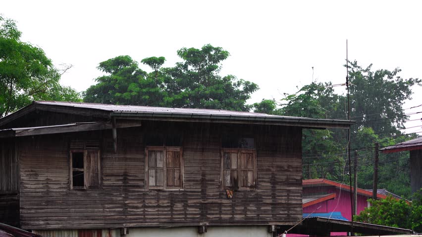 Rain fall from the roof of the house.