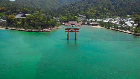 Aerial Drone slow smooth ascent - Itsukushima Shrine at Miyajima, Hiroshima, Japan. D-Cinelike.