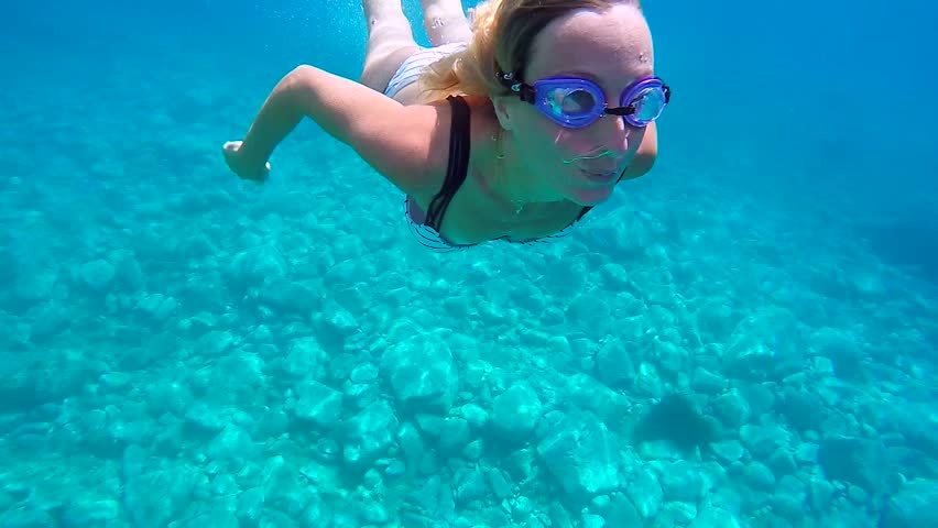 Underwater shot of young woman swimming in clear blue water enjoying vacations in beautiful place. Shot in Sardinia, Italy, Europe.
Travel fun concept shot in 1080 HD format Slow motion | Shutterstock HD Video #1014361481