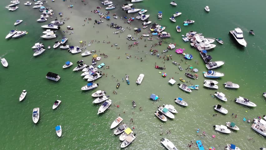 Aerial of annual sand bar party at Johns Pass located in Madeira beach Flor...