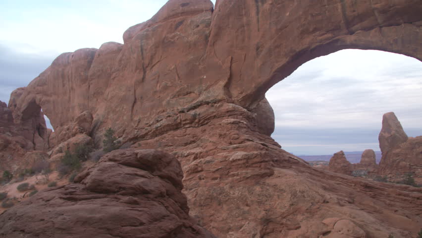 Pan left to right through north window with arch framed within
