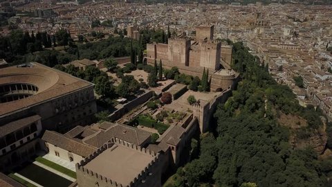 Aerial drone footage of the Alhambra, a famous medieval castle and palace complex overlooking the spanish city of Granada.  This is one of the most famous landmarks in Spain.
