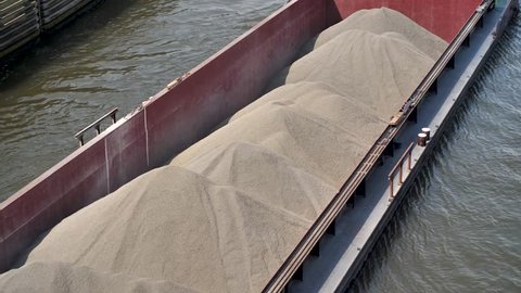 canal barge transporting sand