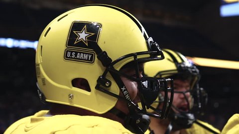SAN ANTONIO, TEXAS - JANUARY 06, 2018: West players huddle up on the sideline in the US Army All American Bowl all star game.