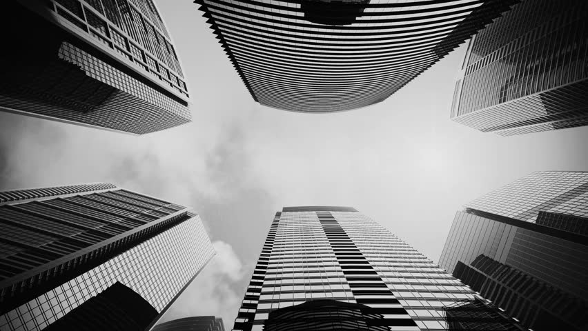 Airplane flying above skyscrapers and reflects in glass modern facades. 
Black and white high rise city centre corporate buildings. Royalty-Free Stock Footage #1014411125