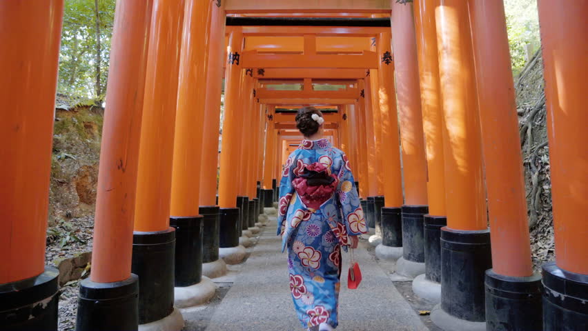Asian women in traditional japanese kimonos walking at Fushimi Inari Shrine in Kyoto, Japan. 4K | Shutterstock HD Video #1014415637