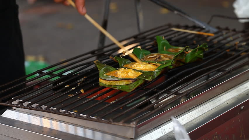 Khai-Pam : THAI STREET FOOD.Khai Pam -Grilled Egg in Banana Leaves.Asian cuisine. Thai cuisine
