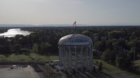 Welcome to Sacramento - Water Tower - farm to fork - city of trees - aerial drone far away view 