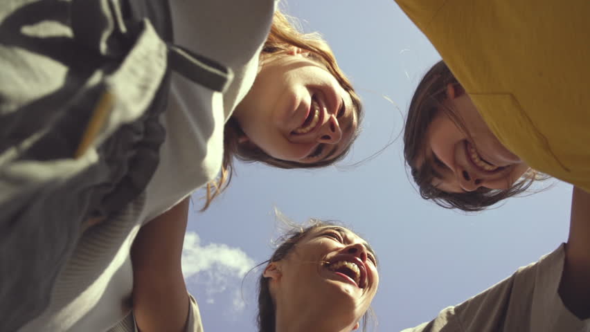 Three girls dancing outdoors