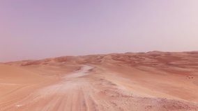 Traveling on an off-road car on the sand of the Rub al Khali desert stock footage video