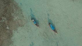 Aerial video above two longtail boats on Laem Tong, Part Of Phi Phi Island. D-Cinelike