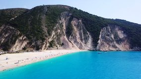 Aerial drone video of iconic turquoise and sapphire bay and beach of Myrtos, Cefalonia island, Ionian, Greece