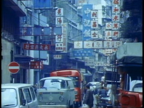 HONG KONG, CHINA, 1982, Hong Kong street scene, traffic, people, Chinese signs