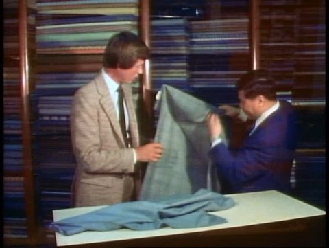 HONG KONG, CHINA, 1982, Hong Kong tailor, customer buying a custom tailored suit