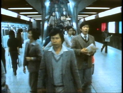 HONG KONG, CHINA, 1982, Hong Kong Subway, escalators, train arrives
