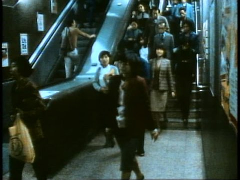 HONG KONG, CHINA, 1982, Hong Kong Subway, people passing through turnstiles