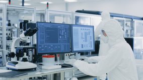 In Laboratory Over the Shoulder View of Scientist in Protective Clothes Doing Research on a Personal Computer. Modern Manufactory Producing Medical Research
 - Powered by Shutterstock - Get 15% off with code: PIKWIZARD15