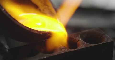 Macro of a goldsmith heating the steel to make a ring. Concept: silver, style, production