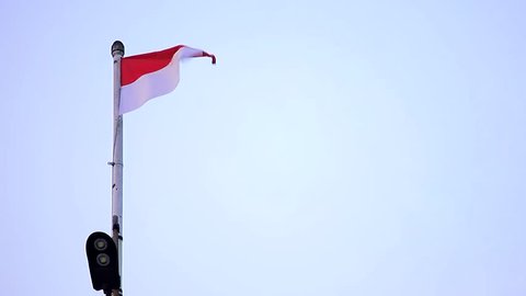 Merah Putih, Indonesian National Flag Fluttering in The Air With Blue Sky Background