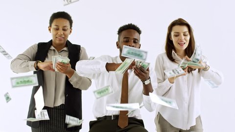 Studio shot of rich Caucasian and black businesspeople making it rain money isolated on light background