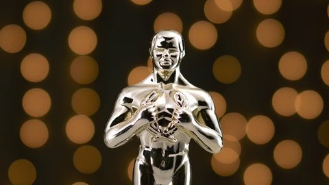 MONTREAL, CANADA - August 2018 : Golden oscar statue on display with the camera turning around the prestigious figure.