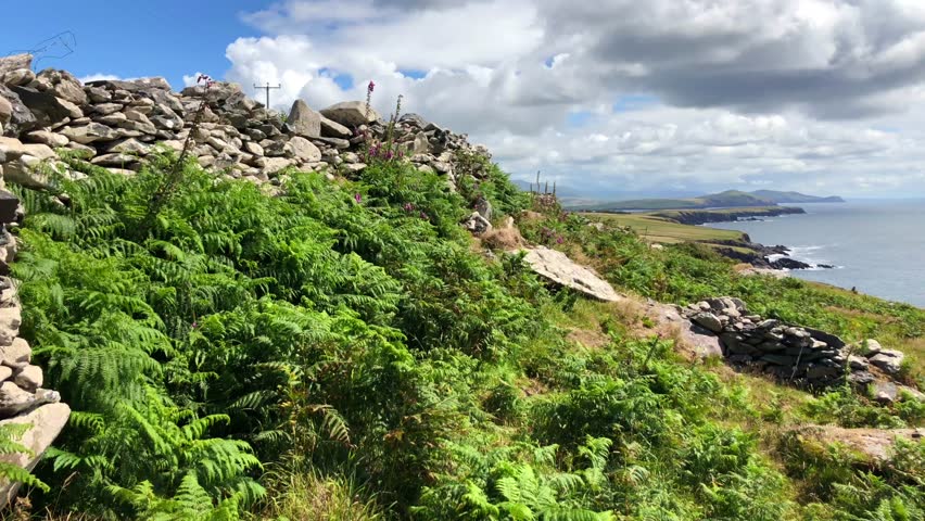 Landscapoe near the collection of beehive huts found on the Slea head, Dingle penninsula, in Ireland.