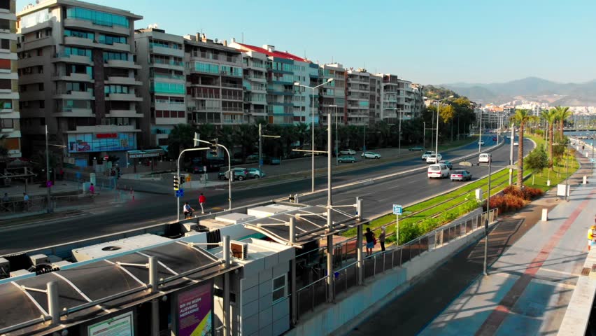 Tram of Izmir riding along the sea side of the city.