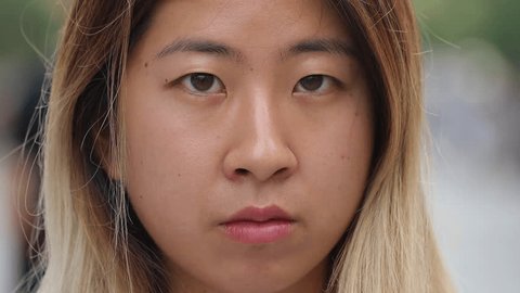 Young woman in city face portrait