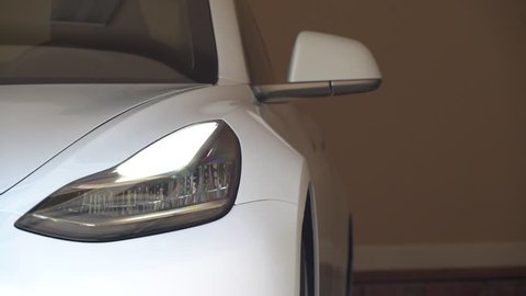 RALEIGH, USA, JULY 03, 2018: A brand new white Tesla Model 3. The model 3 is set to be the Tesla's first mass market electric vehicle
