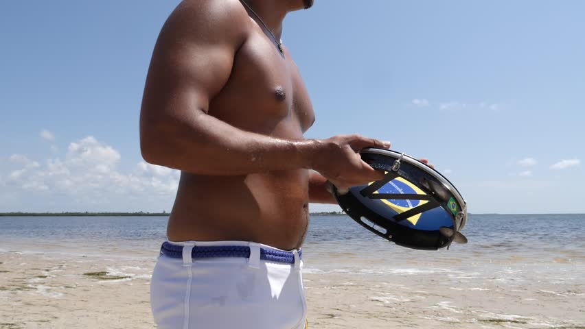 Brazilian culture Capoeira  Musicians Play Brazilian Musical Instruments Artist Playing Berimbau Tambourine Or Pandeiro