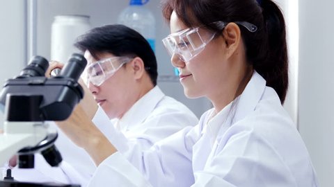 Asian Scientist working together at laboratory. People with medical, science, doctor, healthcare concept. 4K Resolution. Stockvideó