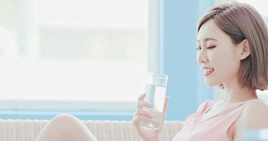 woman drink water and feel happily at home