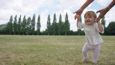 Toddler Learning Walk Holding Their Mothers Stock Footage Video (100% ...