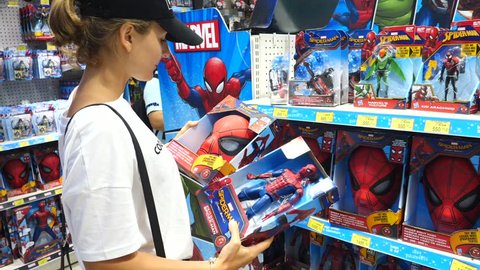 Female Buyer Choosing Spider-Man Figure On Display At Toy Store. Bangkok, Thailand, 12 May, 2018.