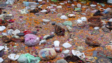 Varanasi, India, November 2015. The Ganges River full of garbage after the pilgrims' offerings.