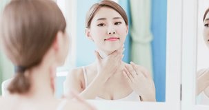 beauty woman apply cream with neck at home