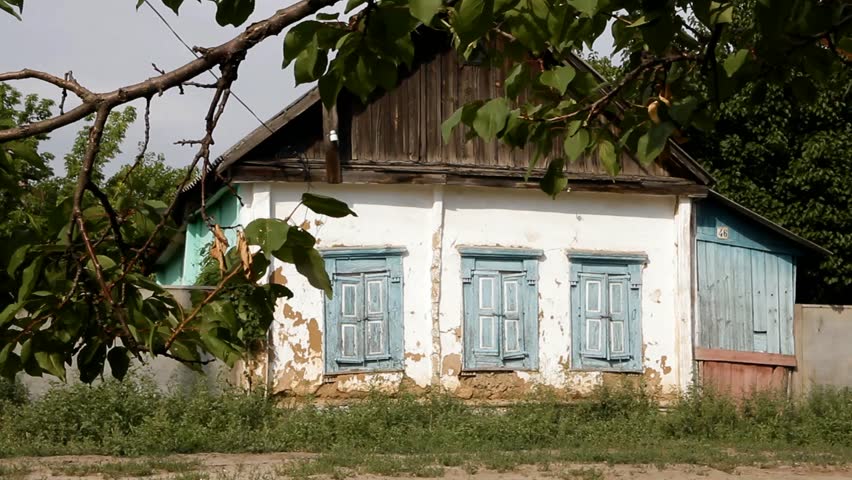 abandoned old house in a village near the road