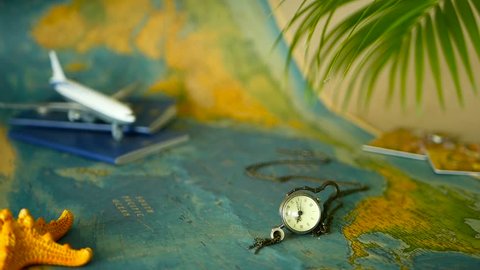 Time to travel concept. Tropical vacation theme with world map, blue passport and plane. Preparing for holliday, journey. Trip items with copy space. North America on the world map. Tourism background