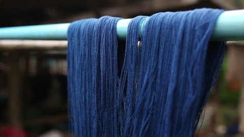 Thai Blue Indigo dyed cloth is a folk wisdom.The device consists of Weaving shuttle, Hand loom ,weaver.Delicate pattern This is a cultural heritage of Thailand.