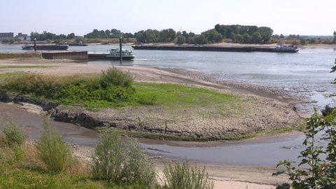 Low water level River Rhine, following unusually dry weather in river catchment area. Tolkamer, The Netherlands - summer 2018