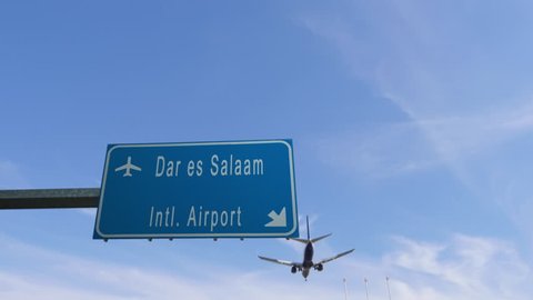 dar es salaam airport sign airplane passing overhead