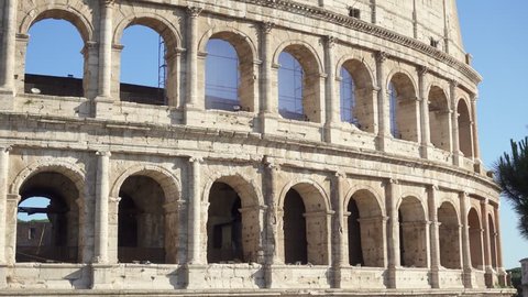 Famous Italian attraction Colosseum in Rome. Veiw on ancient Flavius amphitheater Coliseum in capital of Italy. Camera moving from right to left