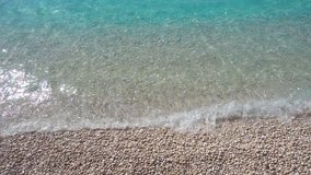 Slow motion video of tropical turquoise sea in Greek ionian island sandy beach