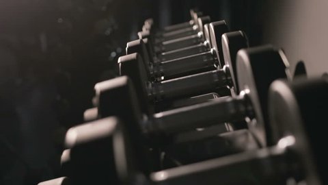 Set, a rack of dumbbells of different sizen for training, close-up