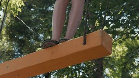 The boy climbs the obstacle course in the camp. A brave boy fulfills the Boy Scout standards - Powered by Shutterstock - Get 15% off with code: PIKWIZARD15