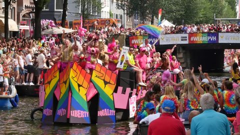 AMSTERDAM, THE NETHERLANDS – AUGUST 4, 2018: Participants and visitors at the Canal Gay Parade 2018