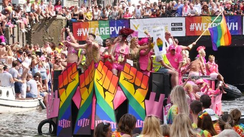 AMSTERDAM, THE NETHERLANDS – AUGUST 4, 2018: Participants and visitors at the Canal Gay Parade 2018