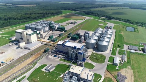 Factory for the production of mixed fodders. Compound feed plant. Feed Mill. Set of storage tanks cultivated agricultural crops processing. Aerial view.