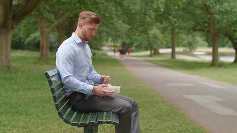 Man Eats Lunch on Bench and Experiences An Upset Stomach